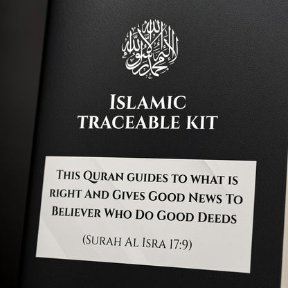 A close-up of a black book or booklet cover with white text reading 'ISLAMIC TRACEABLE KIT' and a white label below containing a Quranic verse. The cover has a subtle textured finish and a white circular Arabic calligraphy emblem near the top.